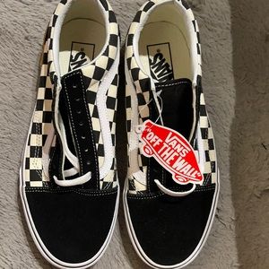 Vans, men’s size 7.5, women’s size 9, black/ white